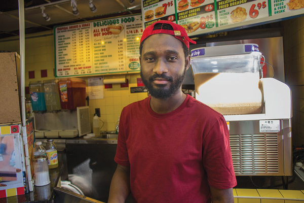 Amadou Cisse was greeted by Manhattan Borough President Gale Brewer, when the Sept. 24 Small Business Crawl made a stop at Papaya Dog. Photo by Naeisha Rose.